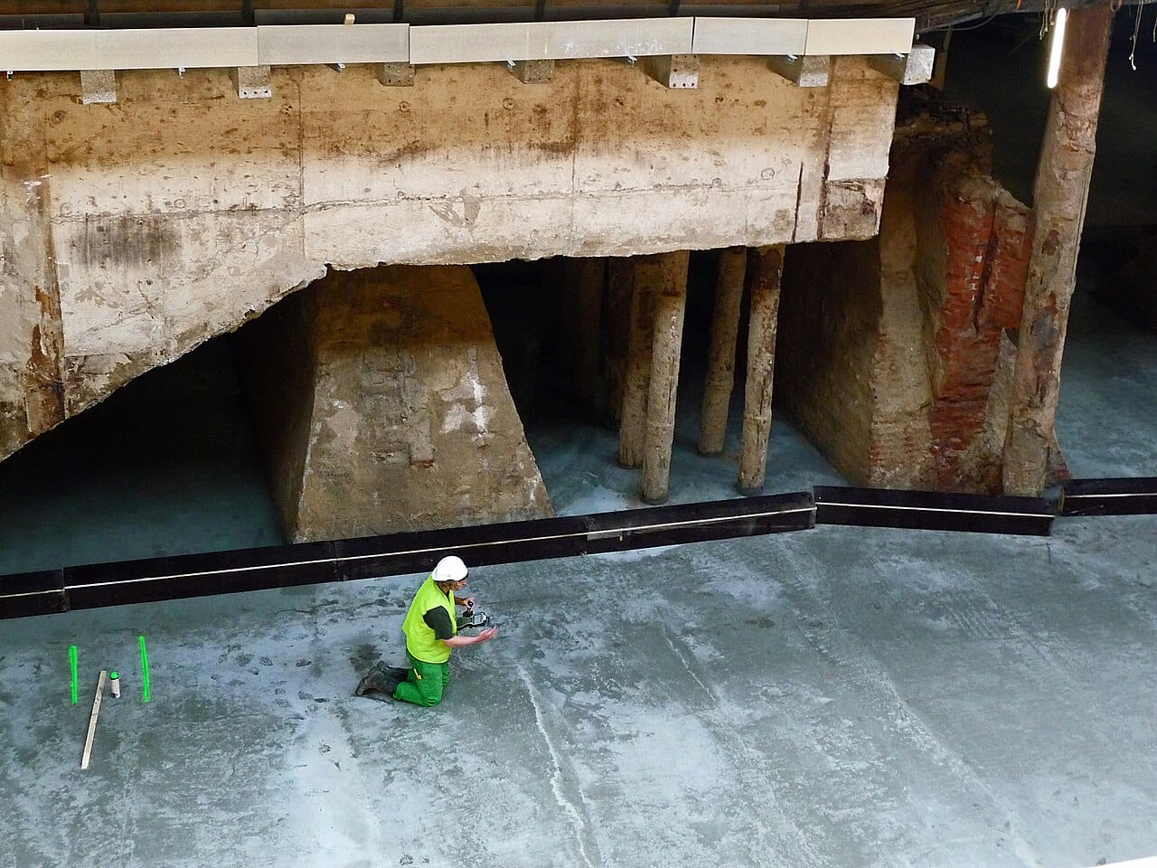 2012.08 - 'Concrete & old brick foundation under Central Station Amsterdam', urban photo of construction activities, Fons Heijnsbroek (12101703396)