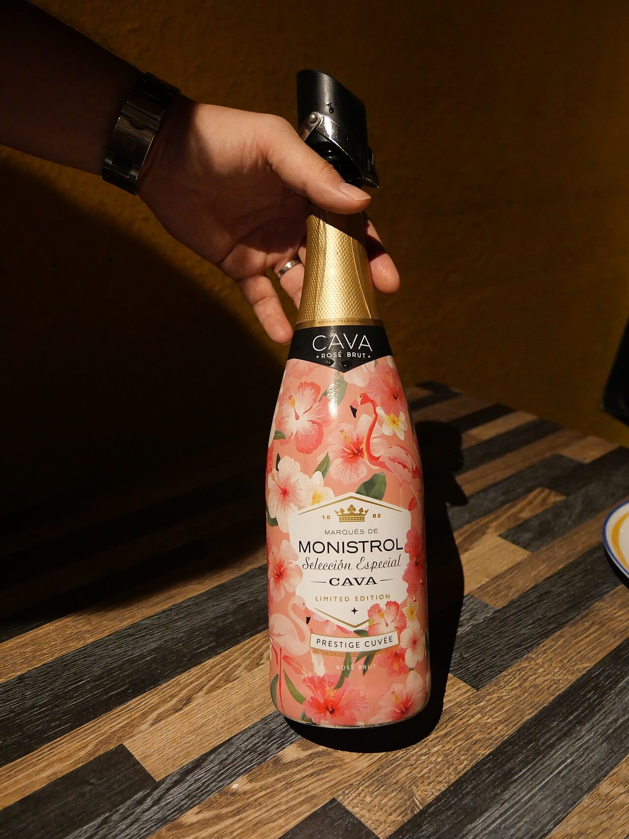A Rose wine bring by waiter hand