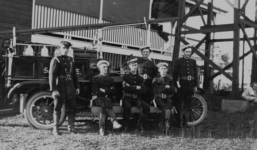 A fire brigade photographed with its appliance, late nineteenth century.