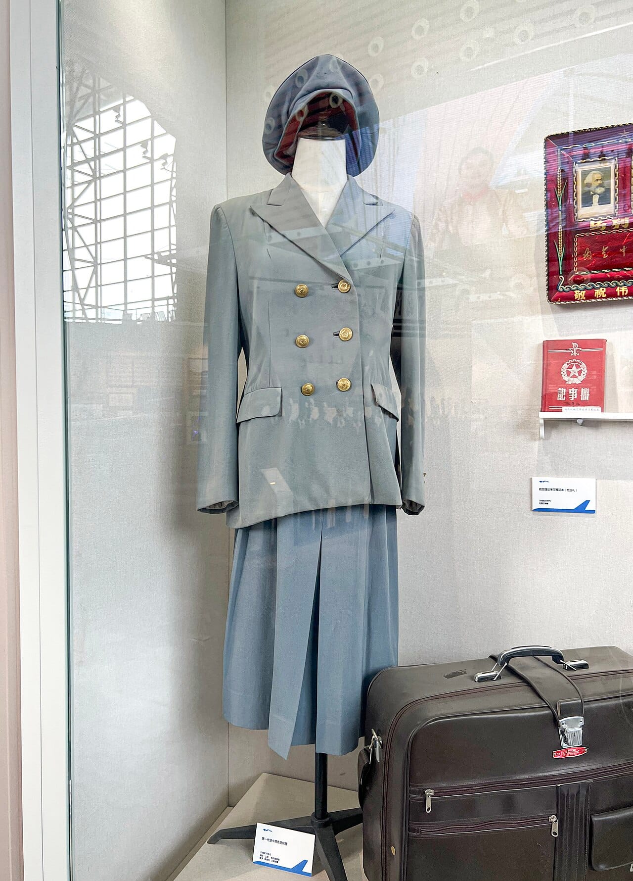 A first-generation national carrier cabin crew uniform, plainly cut.
