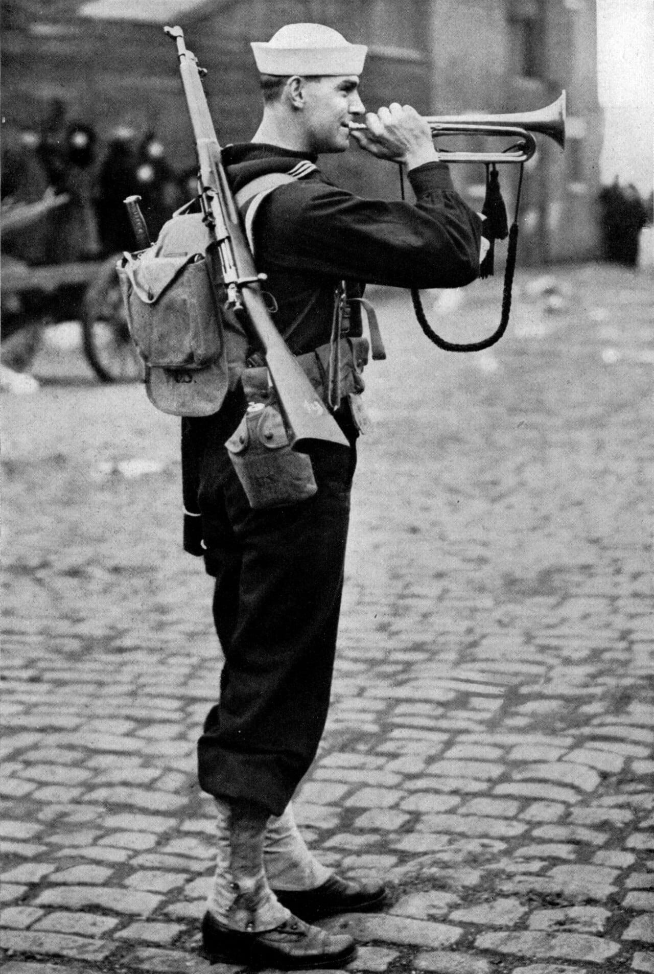 A naval militia bugler in white working dress.