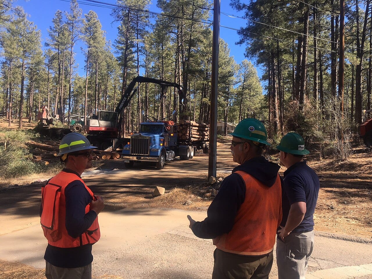 Three workers with a truck (28470681408)