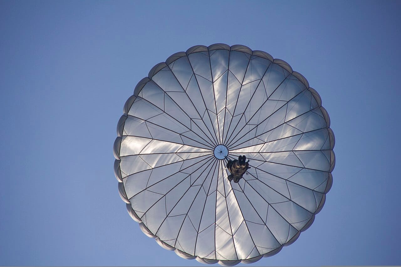 A British Army paratrooper with 4th Battalion, The Parachute Regiment, descends during an airborne mission for Operation Black Warrior at the Luzon Drop Zone, Fort Bragg, N.C., July 18, 2013 130718-A-GI910-320