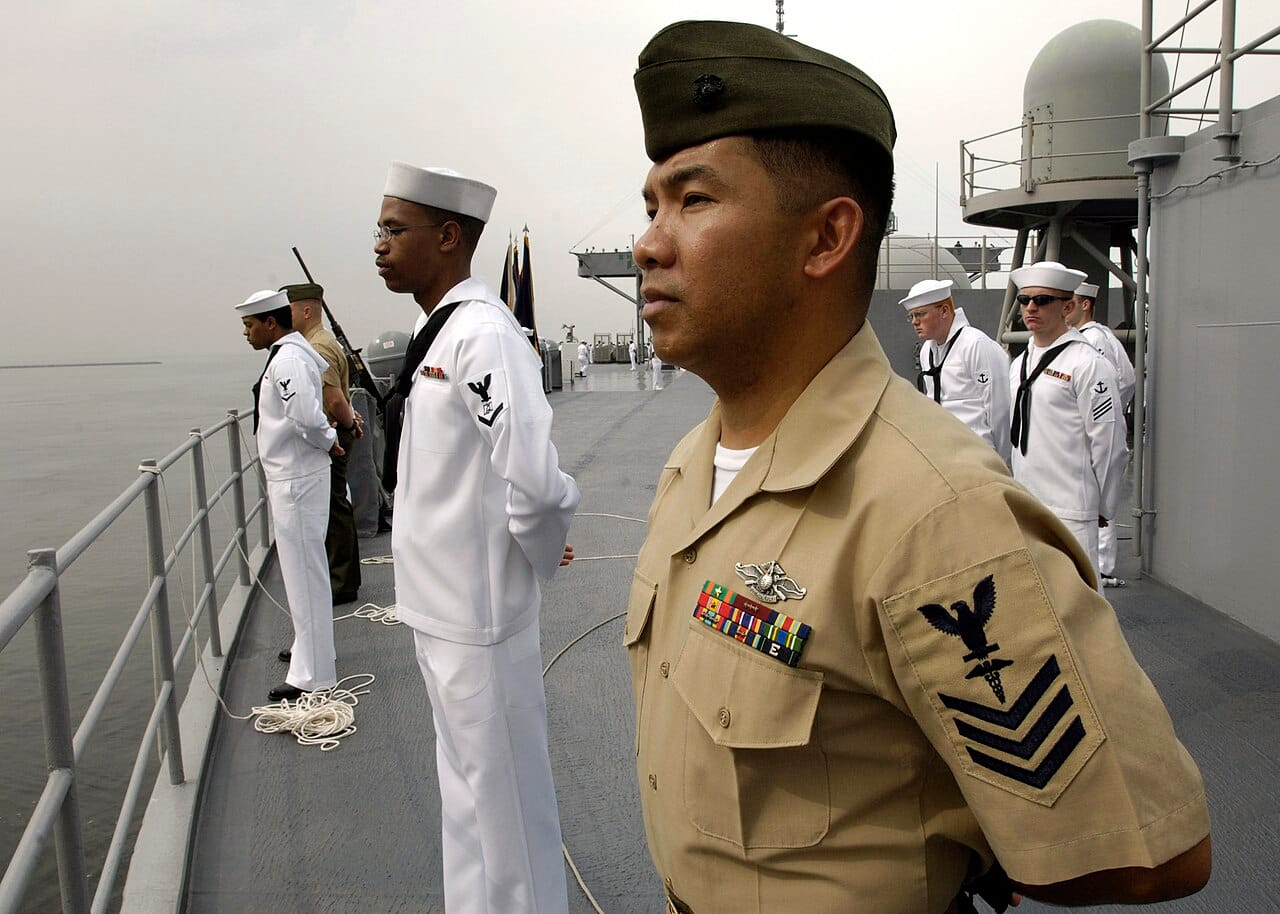 Personnel man the rails on USS Blue Ridge (LCC 19)