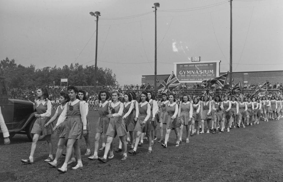 School children marching in a parade.