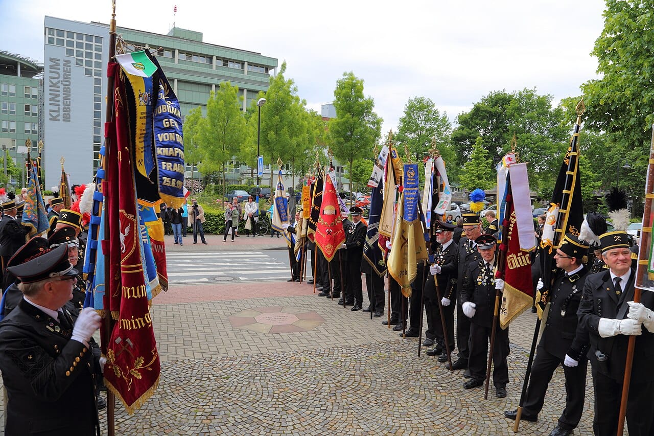 A parade with guild banners.