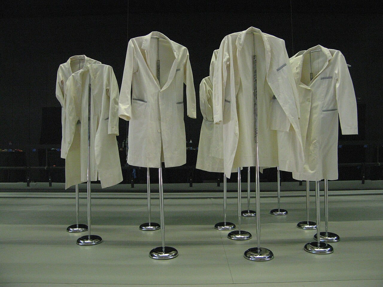 Lab coats on a rail.
