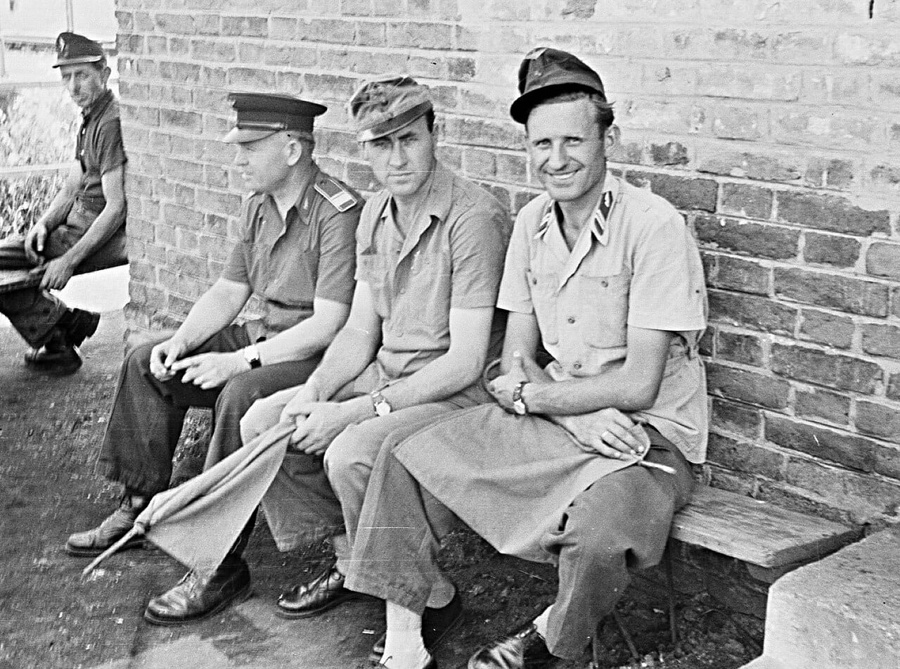 Railway staff posed formally in uniform.