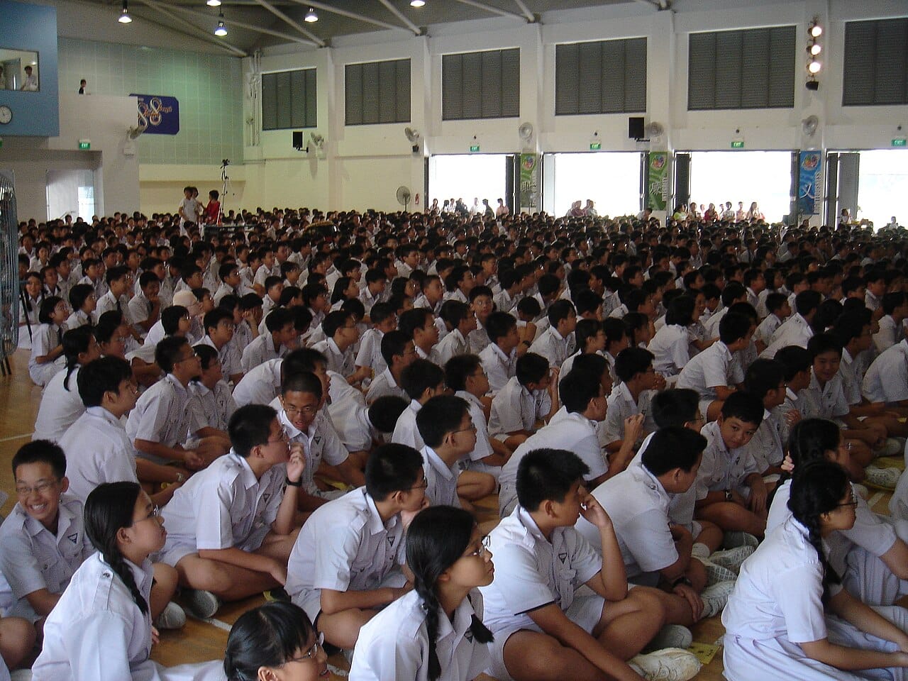 Students of a Singapore high school assembled in a hall.