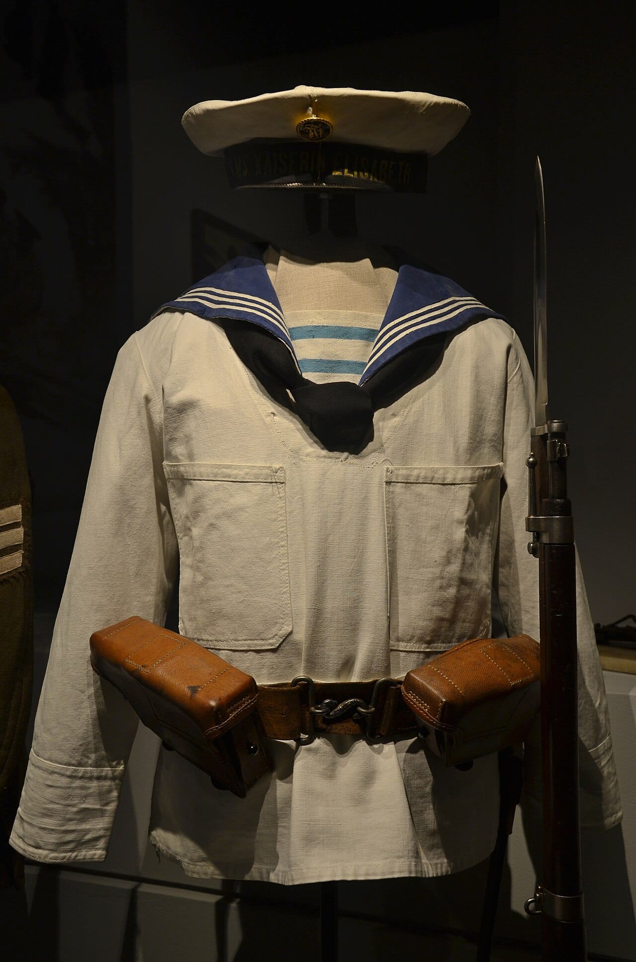 A sailor's uniform preserved in a military history museum.