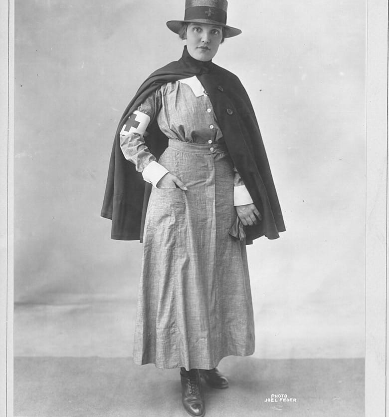 American Red Cross instructional photograph showing what a nurse wore for district work.