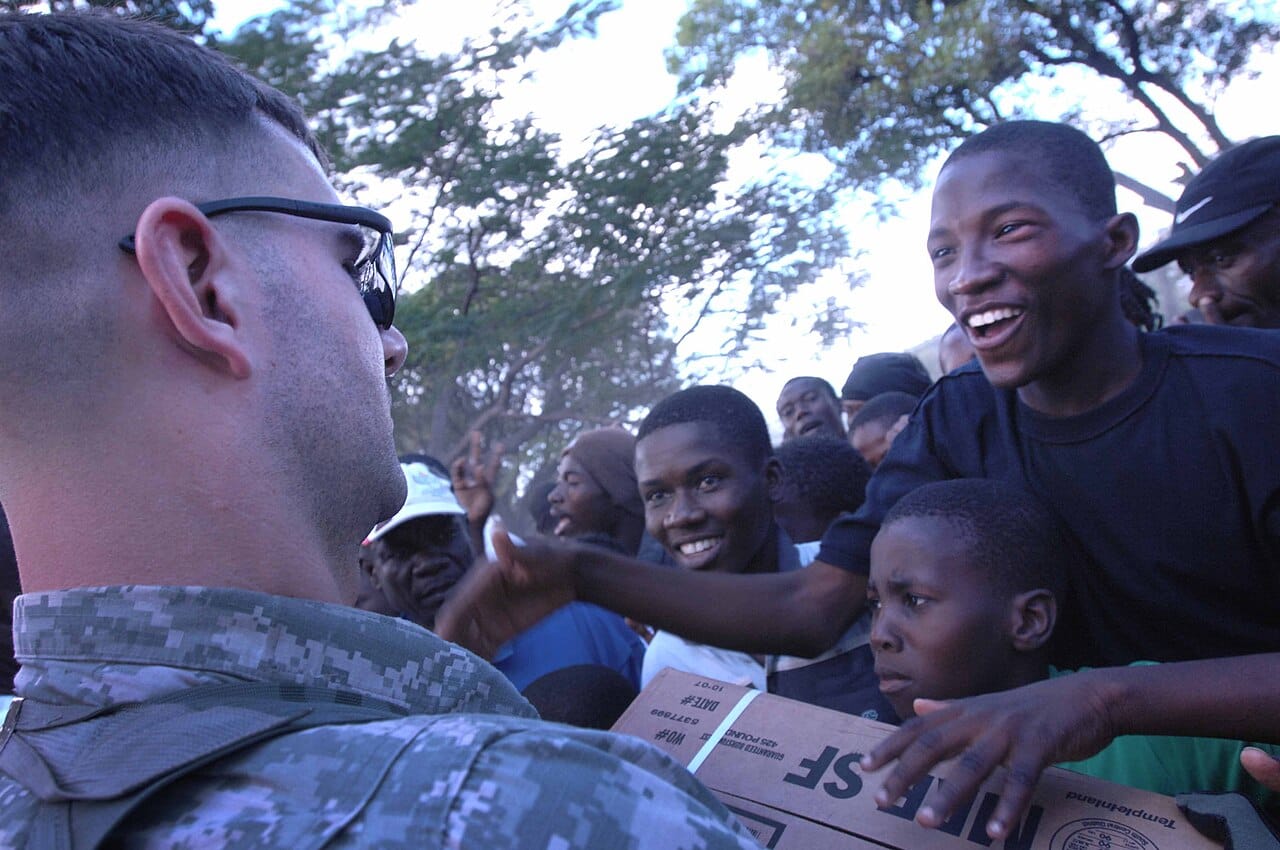 Flickr - The U.S. Army - U.S. troops bring food to survivor camp in Haiti