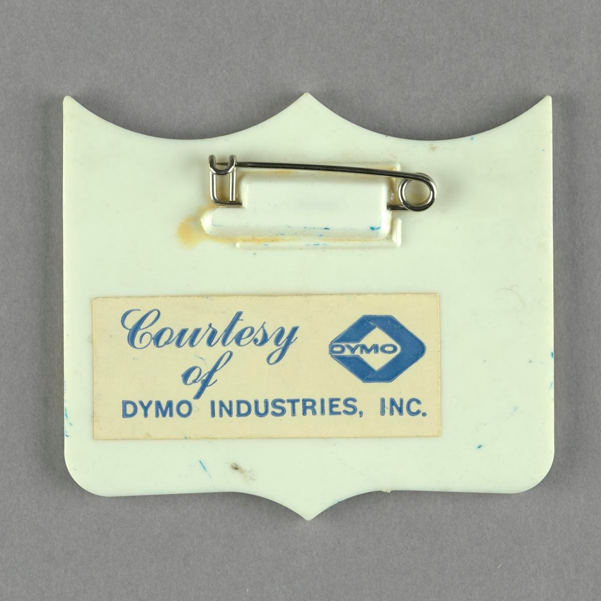 The reverse, with the pin and the mount card.
