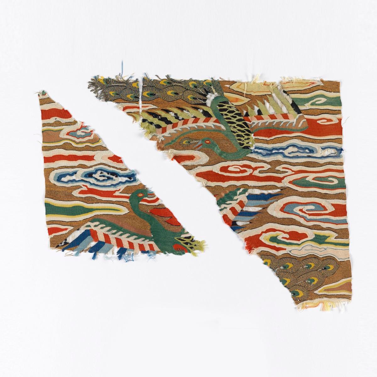 A square of noticeably different quality: denser stitching, more gold, a more elaborate ground.