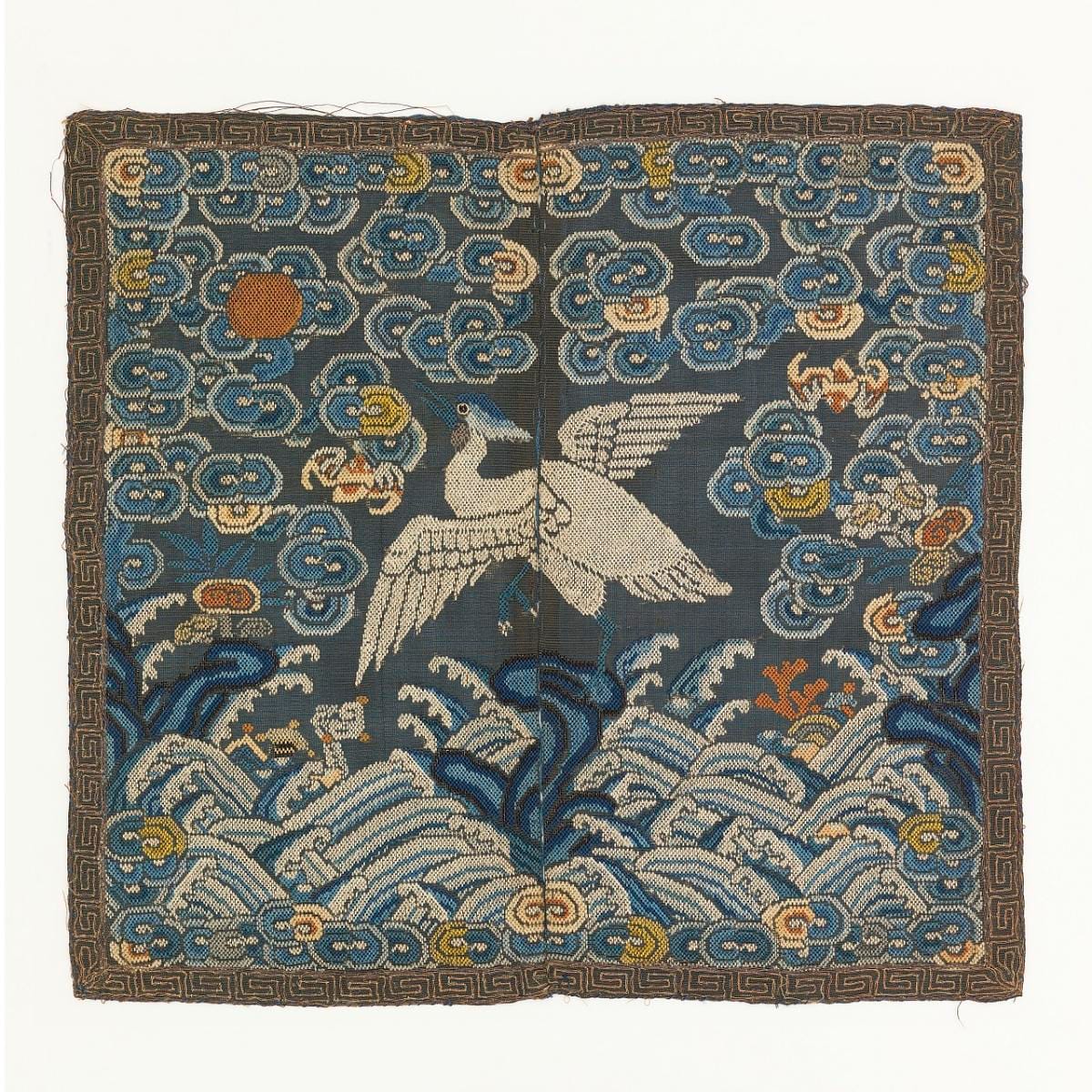 A third square, the embroidery worn thin in places and the gold thread tarnished.