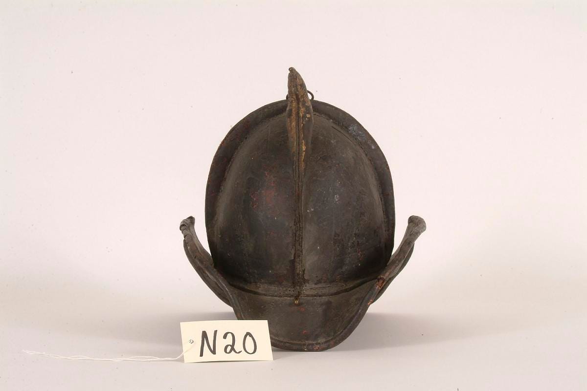 A leather fire helmet lettered "Cataract Hose 1", the rear brim extending well past the crown.