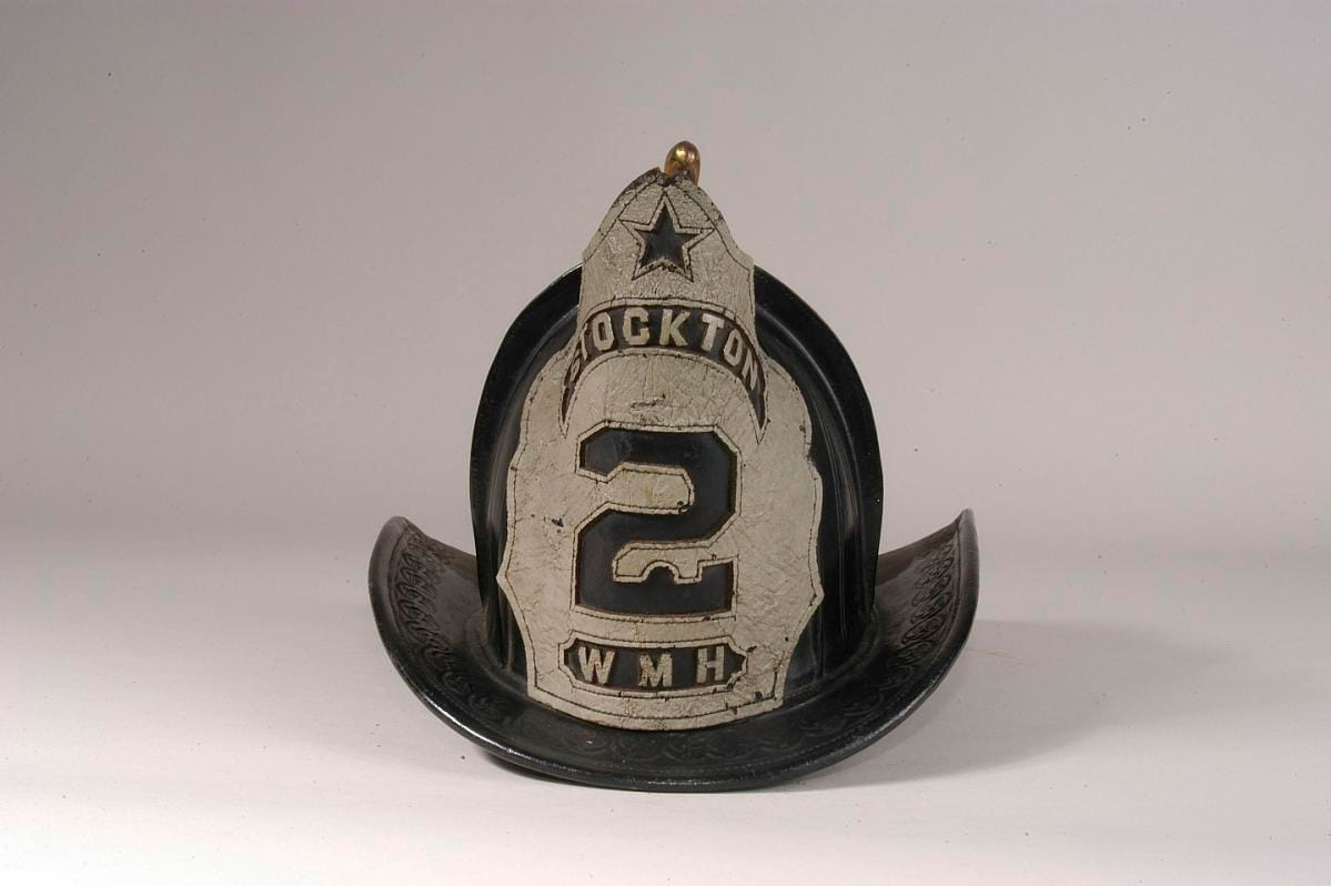 A helmet marked "Stockton 2", seen from the side.