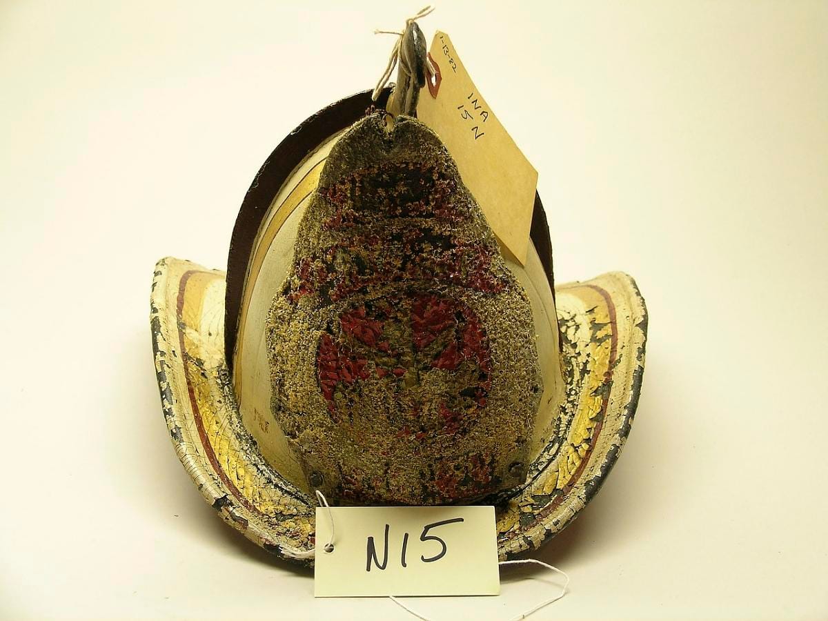 A helmet whose frontpiece reads "Assistant Chief" rather than naming a company.