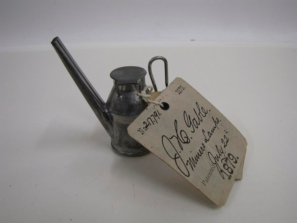 An oil-wick miner's lamp submitted as a patent model.