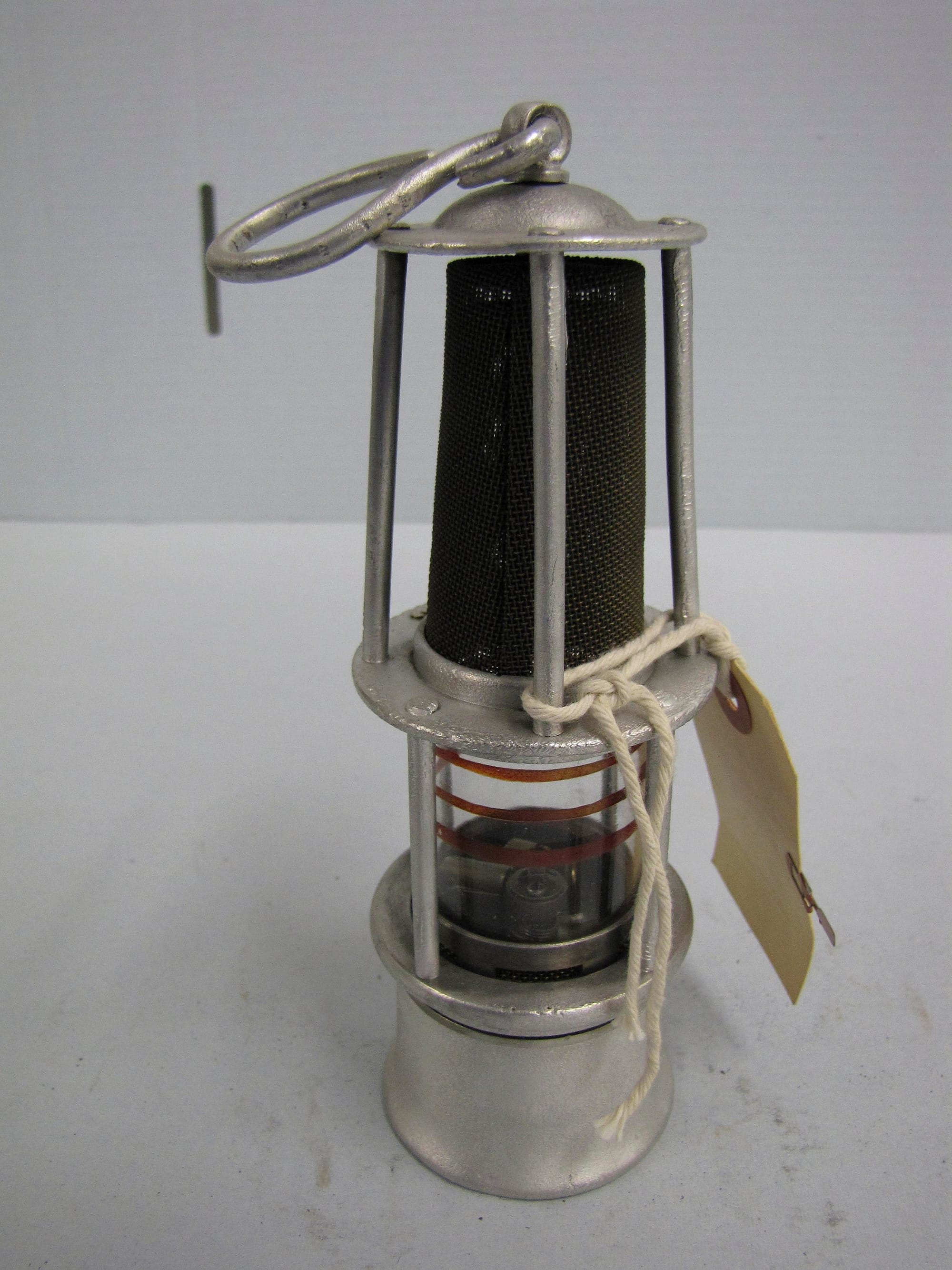 A miner's safety lamp, of the enclosed type.