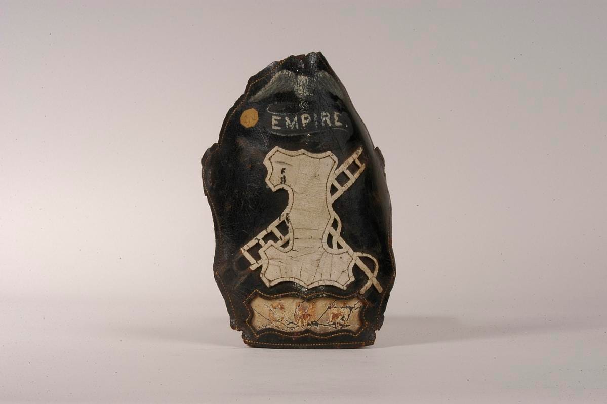 A helmet frontpiece alone, lettered "Empire 1", detached from any helmet.